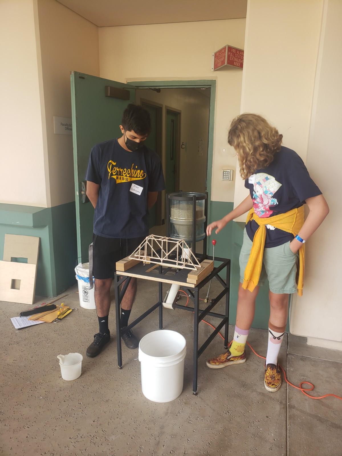 Mike Rodriguez and Sawyer Dunning Zeches working on bridge building